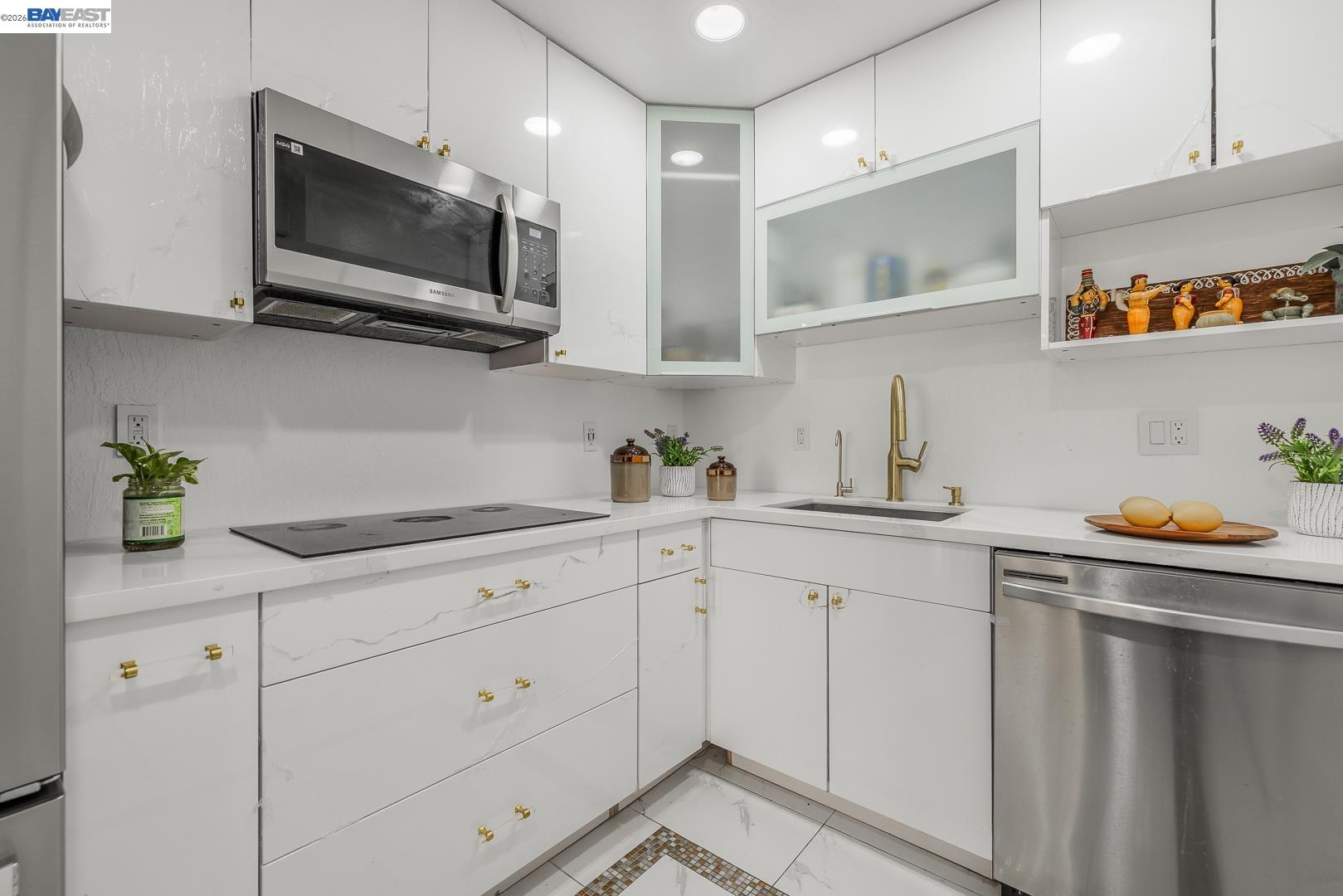 4032 Doane Street Fremont, CA 94538 - Photo 7 of 39 a kitchen with stainless steel appliances white cabinets and a sink
