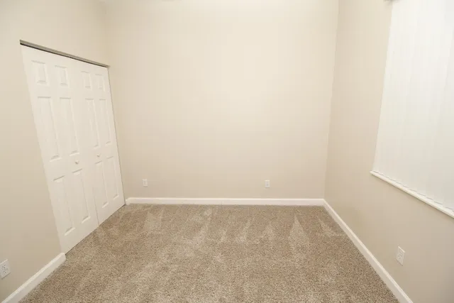 a backyard of a house with yard and outdoor seating