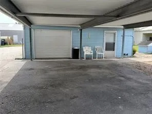 a view of an empty room with a fireplace