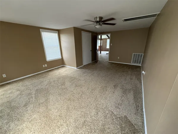 a view of a livingroom with a staircase