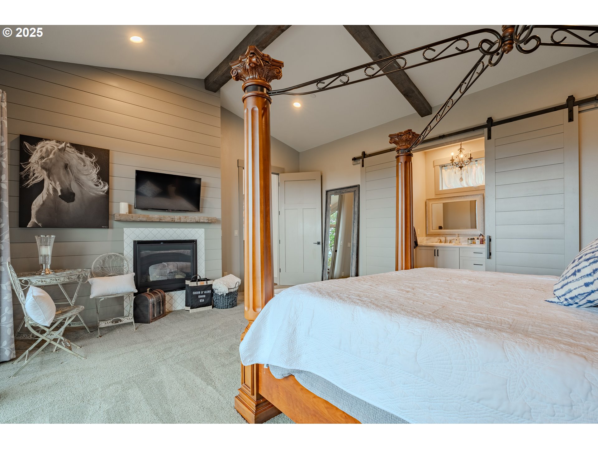 2012 Northwest Sierra Lane Camas, WA 98607 - Photo 17 of 42 a spacious bedroom with a bed and a fireplace