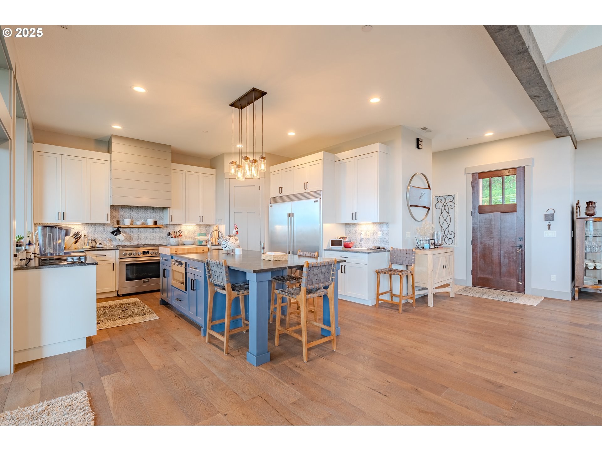 2012 Northwest Sierra Lane Camas, WA 98607 - Photo 2 of 42 a open kitchen view with stainless steel appliances refrigerator dining table and chairs