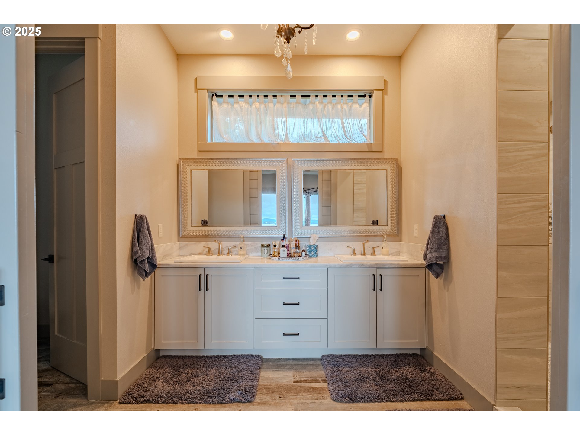 2012 Northwest Sierra Lane Camas, WA 98607 - Photo 21 of 42 a view of bathroom with bathtub cabinet and mirror