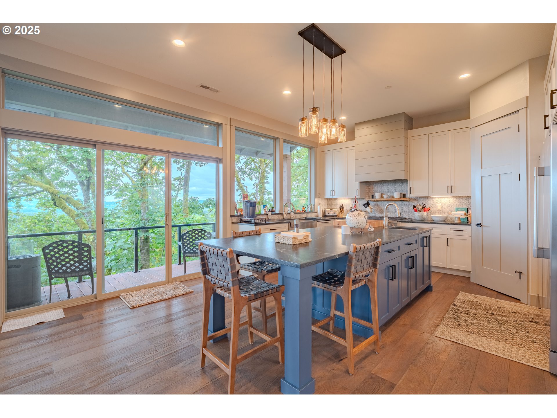 2012 Northwest Sierra Lane Camas, WA 98607 - Photo 4 of 42 a open kitchen with stainless steel appliances granite countertop a stove dining table and chairs