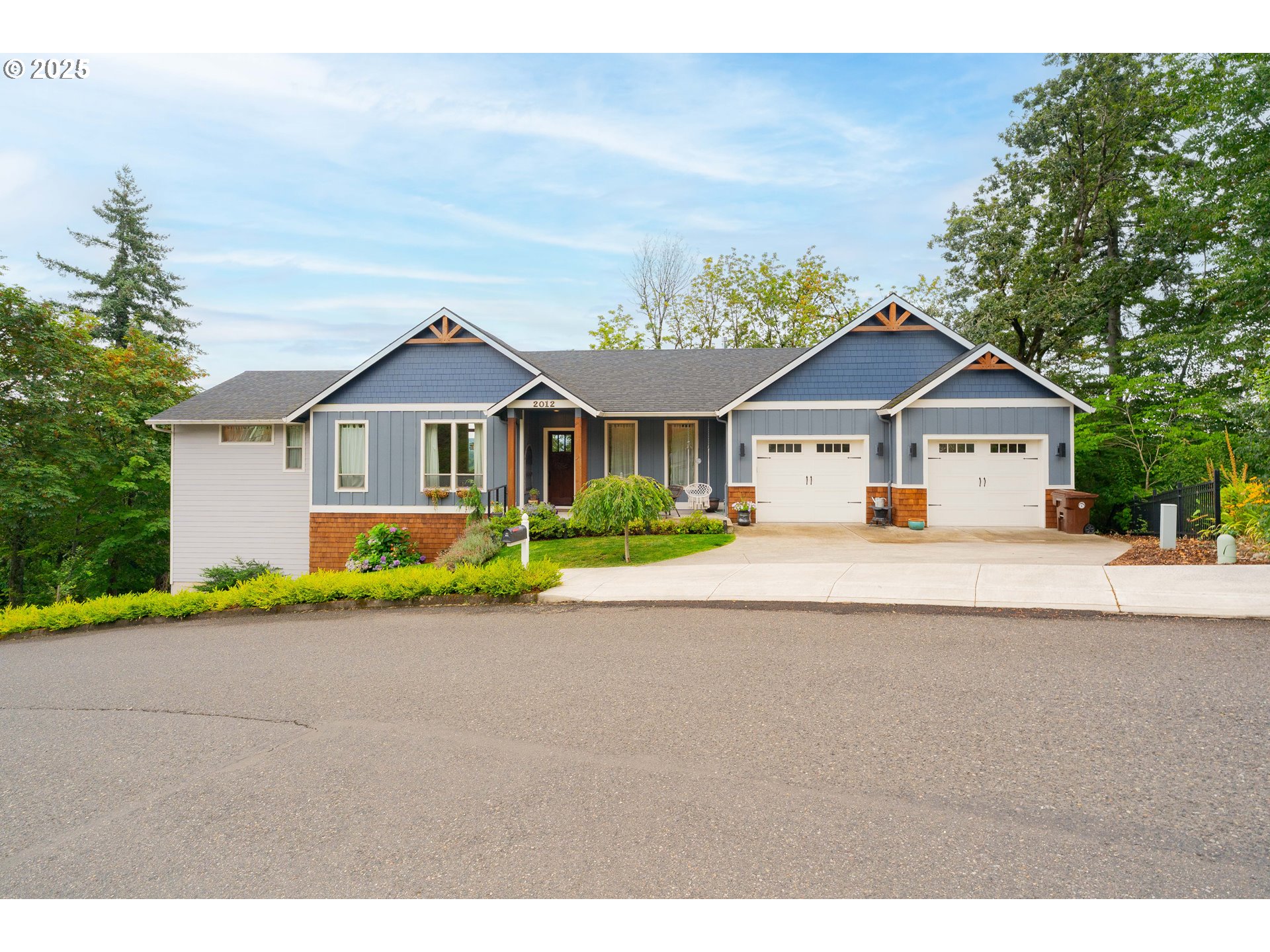 2012 Northwest Sierra Lane Camas, WA 98607 - Photo 41 of 42 a front view of a house with a yard and garage