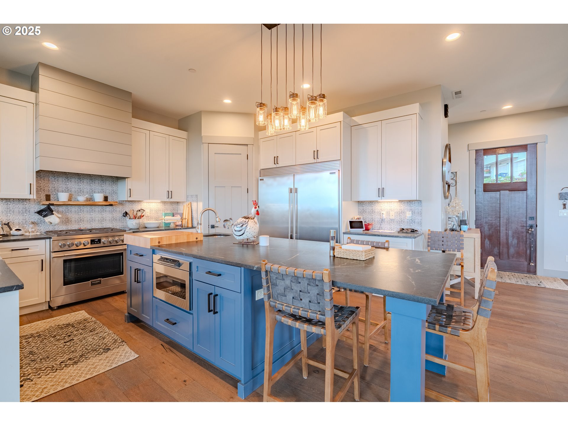 2012 Northwest Sierra Lane Camas, WA 98607 - Photo 5 of 42 a kitchen with kitchen island granite countertop a sink cabinets and stainless steel appliances