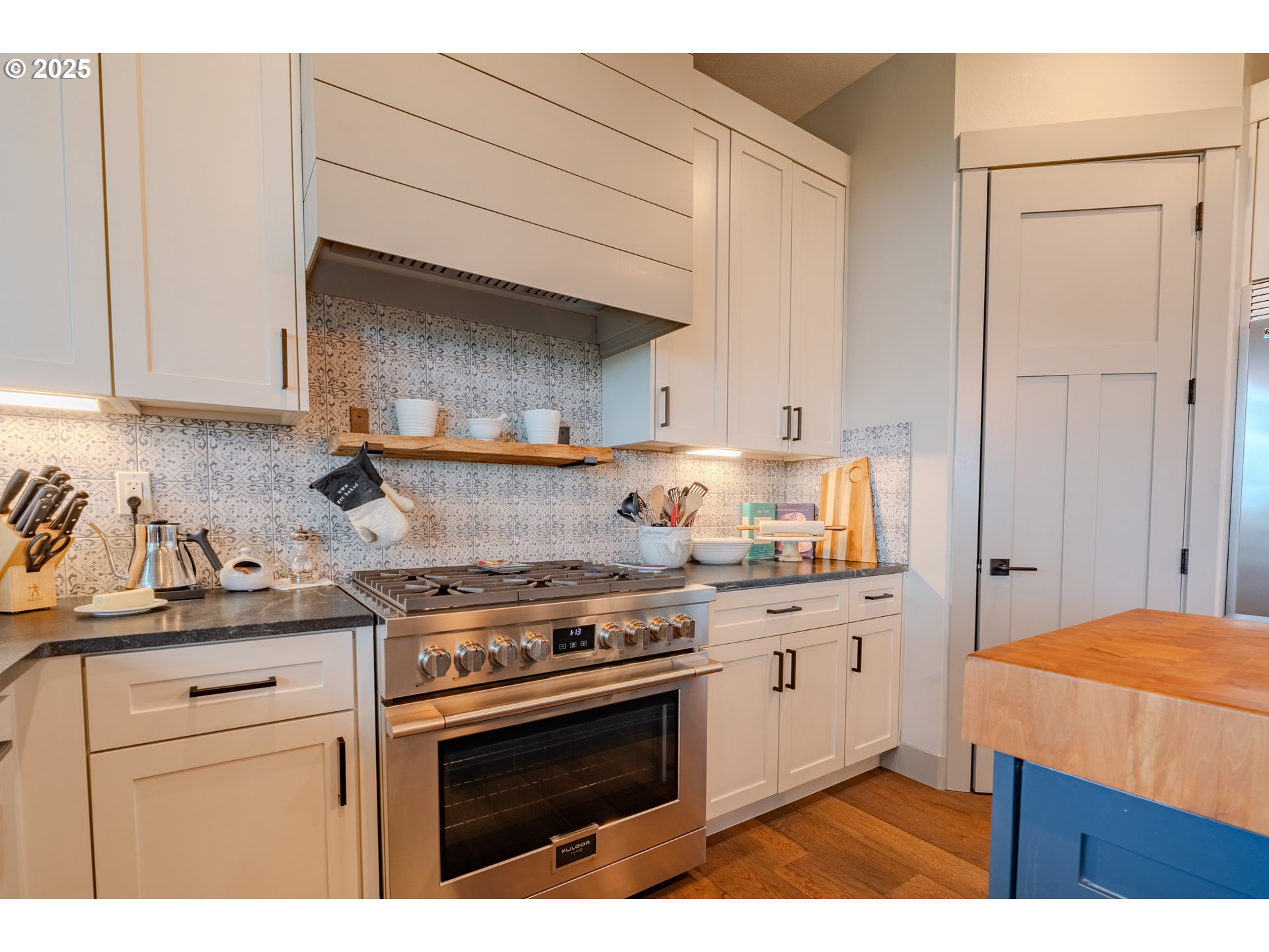 2012 Northwest Sierra Lane Camas, WA 98607 - Photo 7 of 42 a kitchen with a stove top oven sink and cabinets