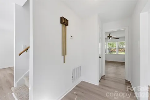 a view of an entryway with wooden floor