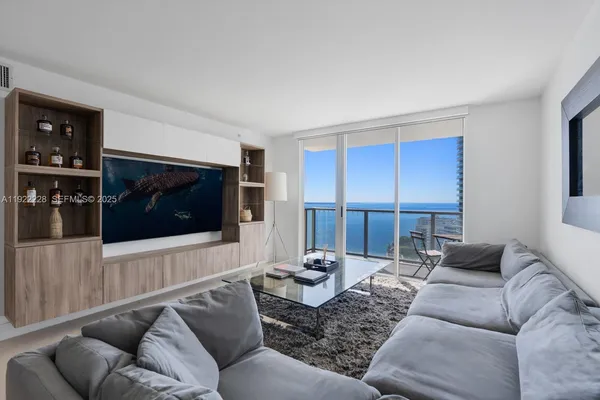 a living room with furniture and a flat screen tv