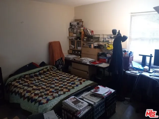 a bed room with furniture and a window