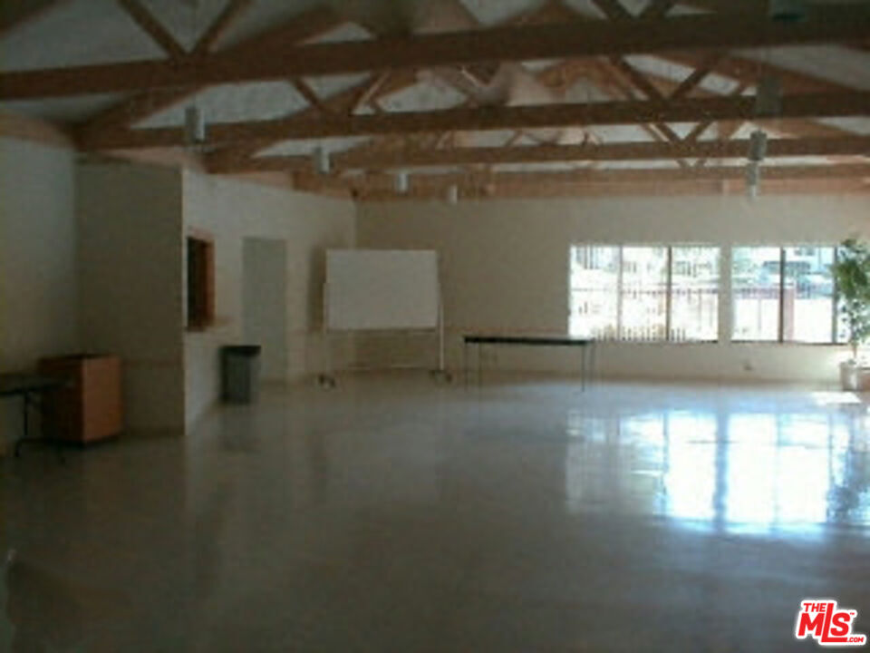 5832 Bowcroft Street, Unit 4 Los Angeles, CA 90016 - Photo 17 of 34 a view of a livingroom with wooden floor and a window