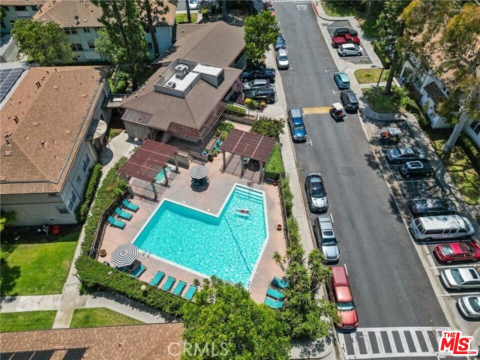 5832 Bowcroft Street, Unit 4 Los Angeles, CA 90016 - Photo 19 of 34 an aerial view of a house with a garden and trees