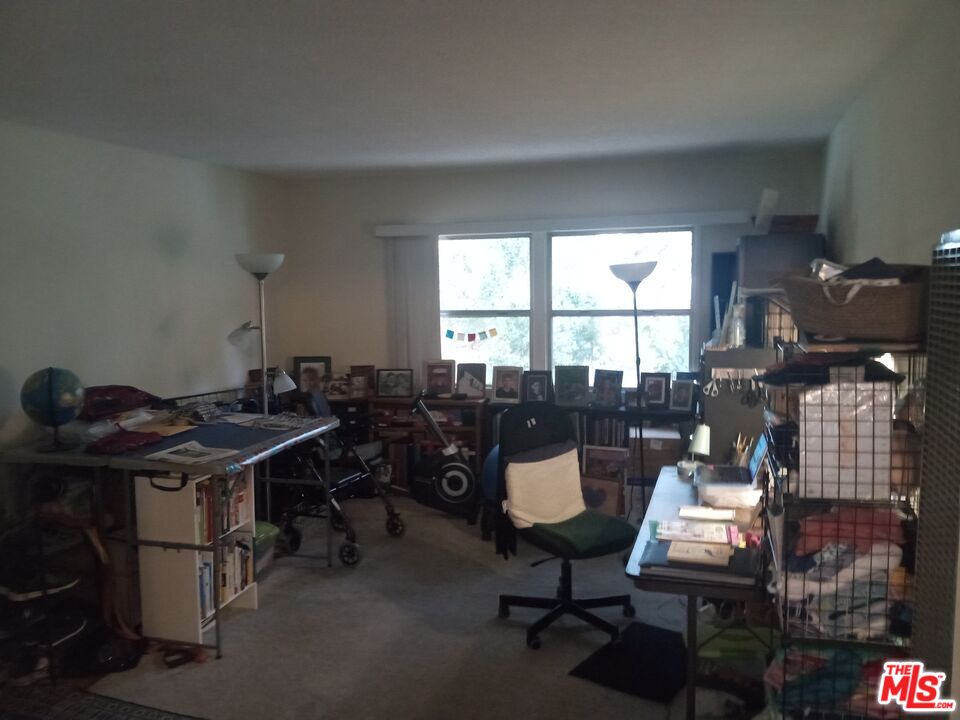 5832 Bowcroft Street, Unit 4 Los Angeles, CA 90016 - Photo 4 of 34 a view of a workspace with furniture and a window