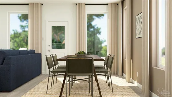a dining room with furniture and wooden floor