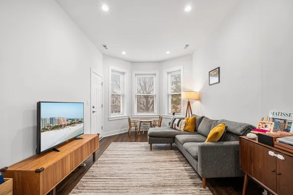 a living room with furniture and a large window