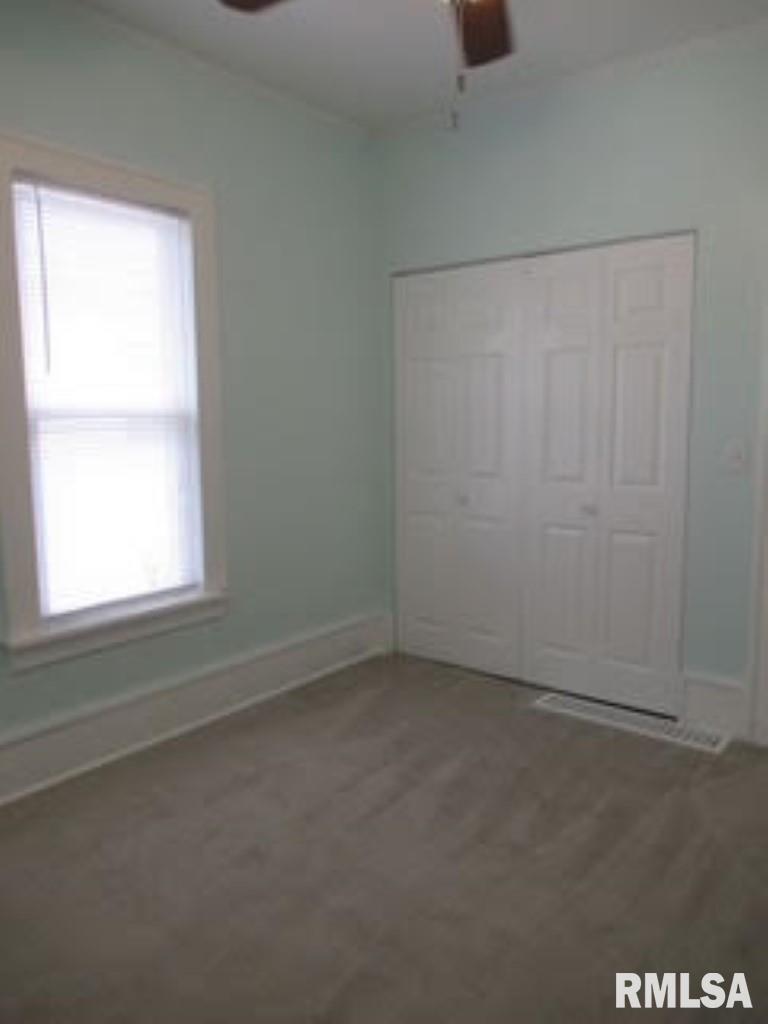 1525 25th Street Rock Island, IL 61201 - Photo 6 of 16 an empty room with a window