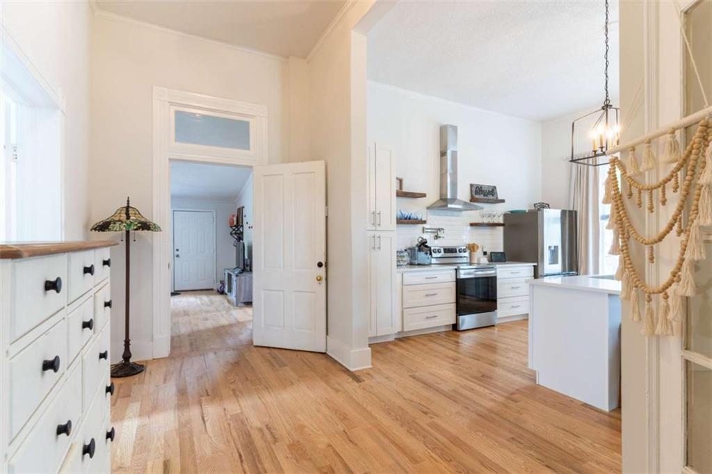 2173 Anderson Avenue Northeast Covington, GA 30014 - Photo 12 of 49 a kitchen with granite countertop a refrigerator and a stove top oven