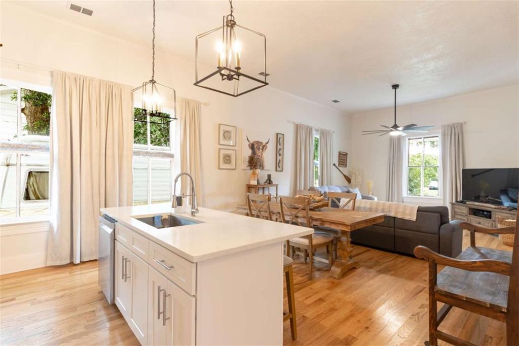 2173 Anderson Avenue Northeast Covington, GA 30014 - Photo 13 of 49 a view of living room with kitchen island furniture and a chandelier