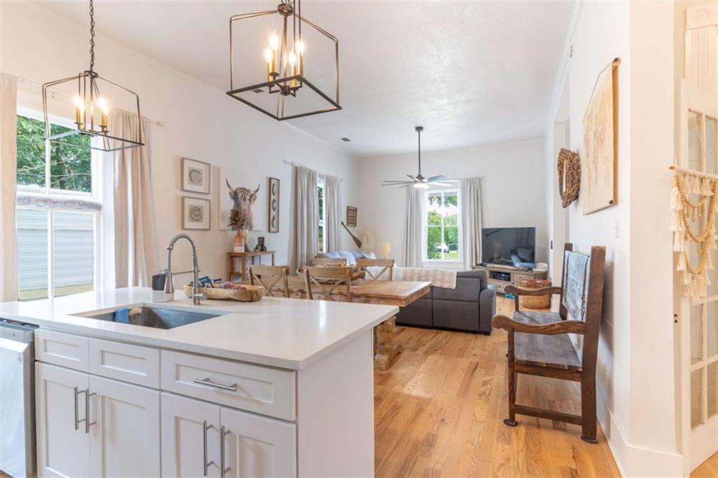 2173 Anderson Avenue Northeast Covington, GA 30014 - Photo 14 of 49 a view of living room with kitchen island furniture and a chandelier