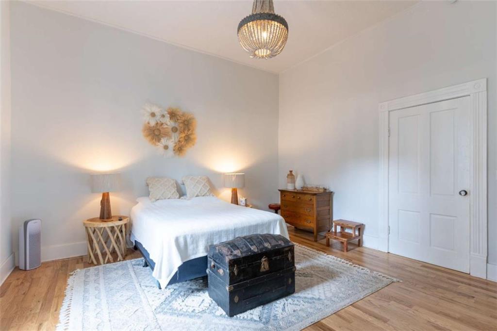 2173 Anderson Avenue Northeast Covington, GA 30014 - Photo 21 of 49 a bedroom with a bed and wooden floor