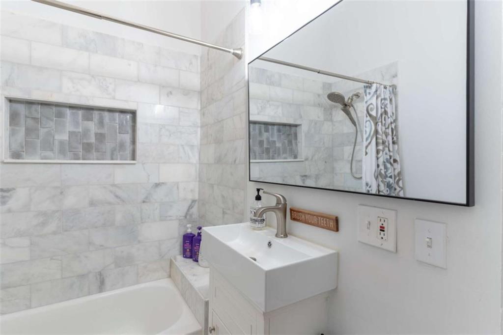 2173 Anderson Avenue Northeast Covington, GA 30014 - Photo 27 of 49 a bathroom with a sink and a mirror