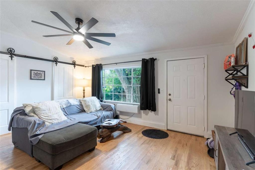 2173 Anderson Avenue Northeast Covington, GA 30014 - Photo 29 of 49 a living room with furniture and a large window