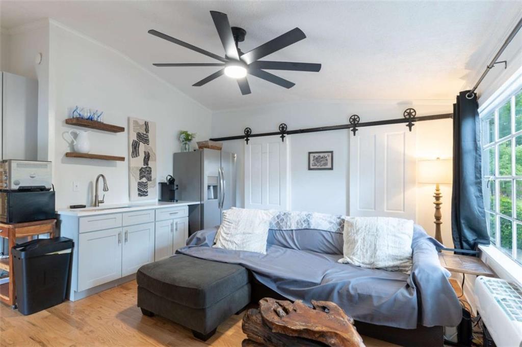 2173 Anderson Avenue Northeast Covington, GA 30014 - Photo 30 of 49 a living room with furniture and a large window