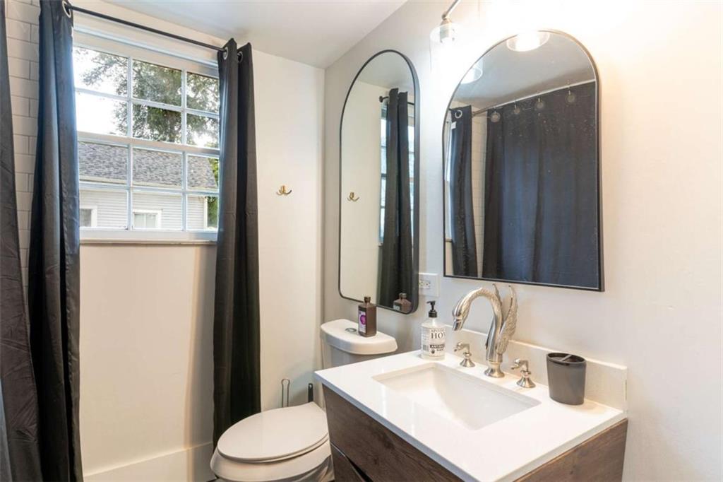 2173 Anderson Avenue Northeast Covington, GA 30014 - Photo 36 of 49 a bathroom with a toilet sink and mirror