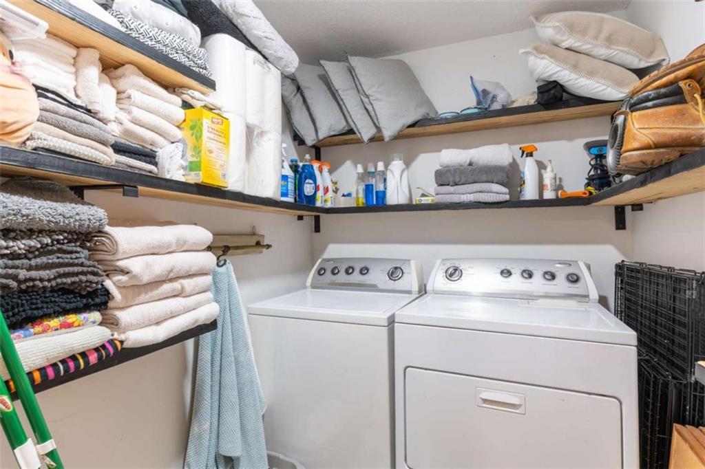 2173 Anderson Avenue Northeast Covington, GA 30014 - Photo 38 of 49 a view of storage and utility room with washer and dryer