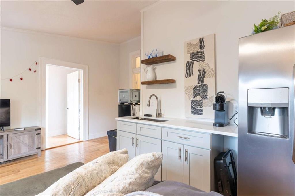 2173 Anderson Avenue Northeast Covington, GA 30014 - Photo 39 of 49 a kitchen with a sink and a refrigerator