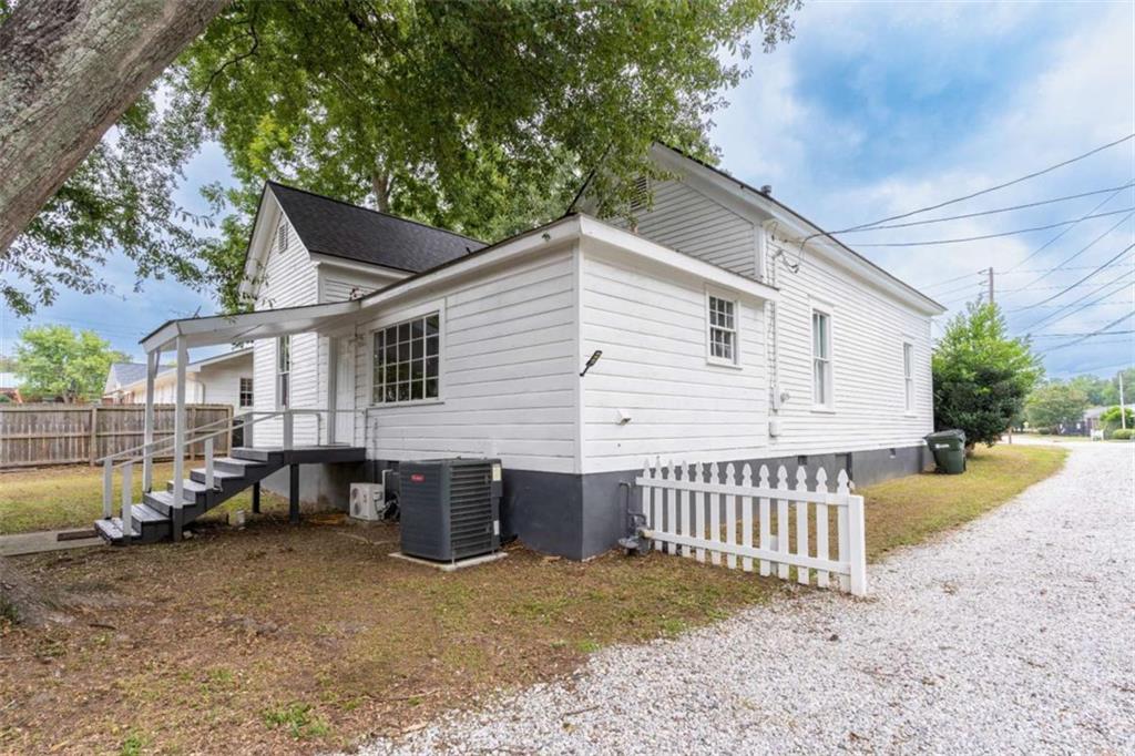 2173 Anderson Avenue Northeast Covington, GA 30014 - Photo 42 of 49 a view of a house with a yard and a patio