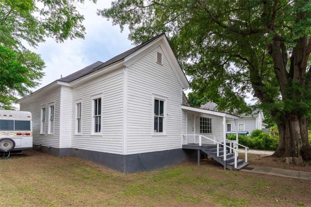 2173 Anderson Avenue Northeast Covington, GA 30014 - Photo 45 of 49 a view of a house with a patio and a yard