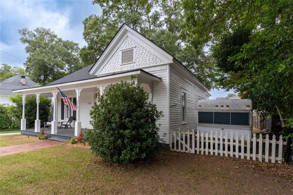 2173 Anderson Avenue Northeast Covington, GA 30014 - Photo 46 of 49 a front view of a house with a garden