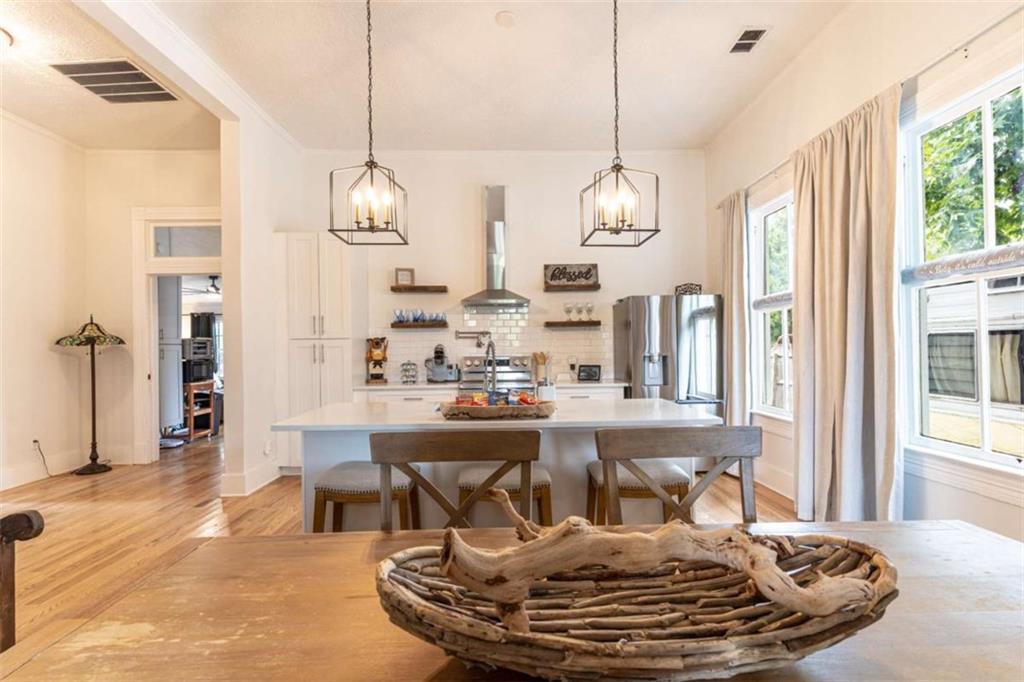 2173 Anderson Avenue Northeast Covington, GA 30014 - Photo 9 of 49 a dining room with furniture a chandelier and wooden floor