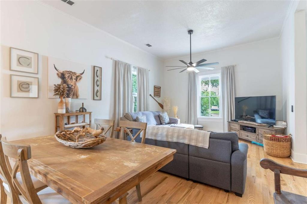 2173 Anderson Avenue Northeast Covington, GA 30014 - Photo 10 of 49 a living room with furniture a flat screen tv and a large window