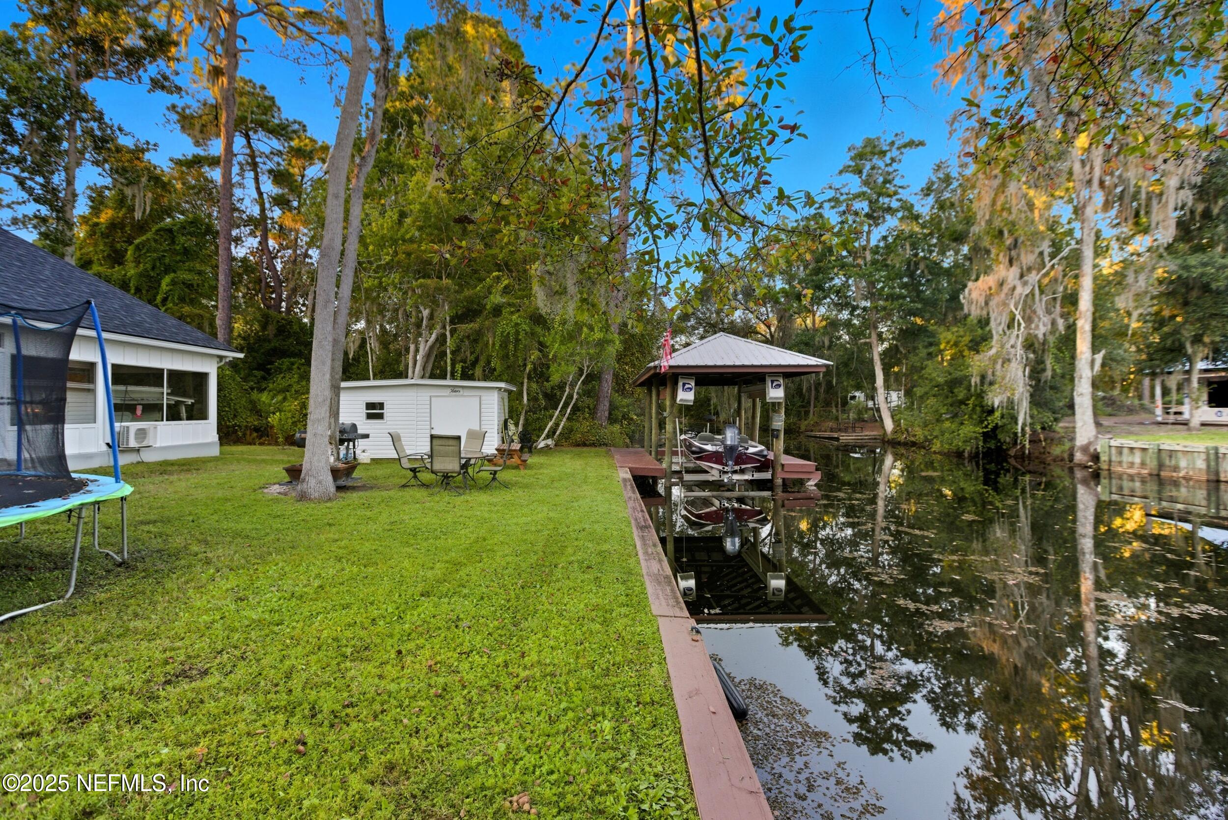 128 Santa Rosa Street Florahome, FL 32140 - Photo 45 of 57 a front view of a house with a garden
