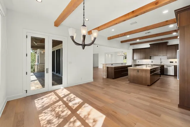 a view of hallway with wooden floor