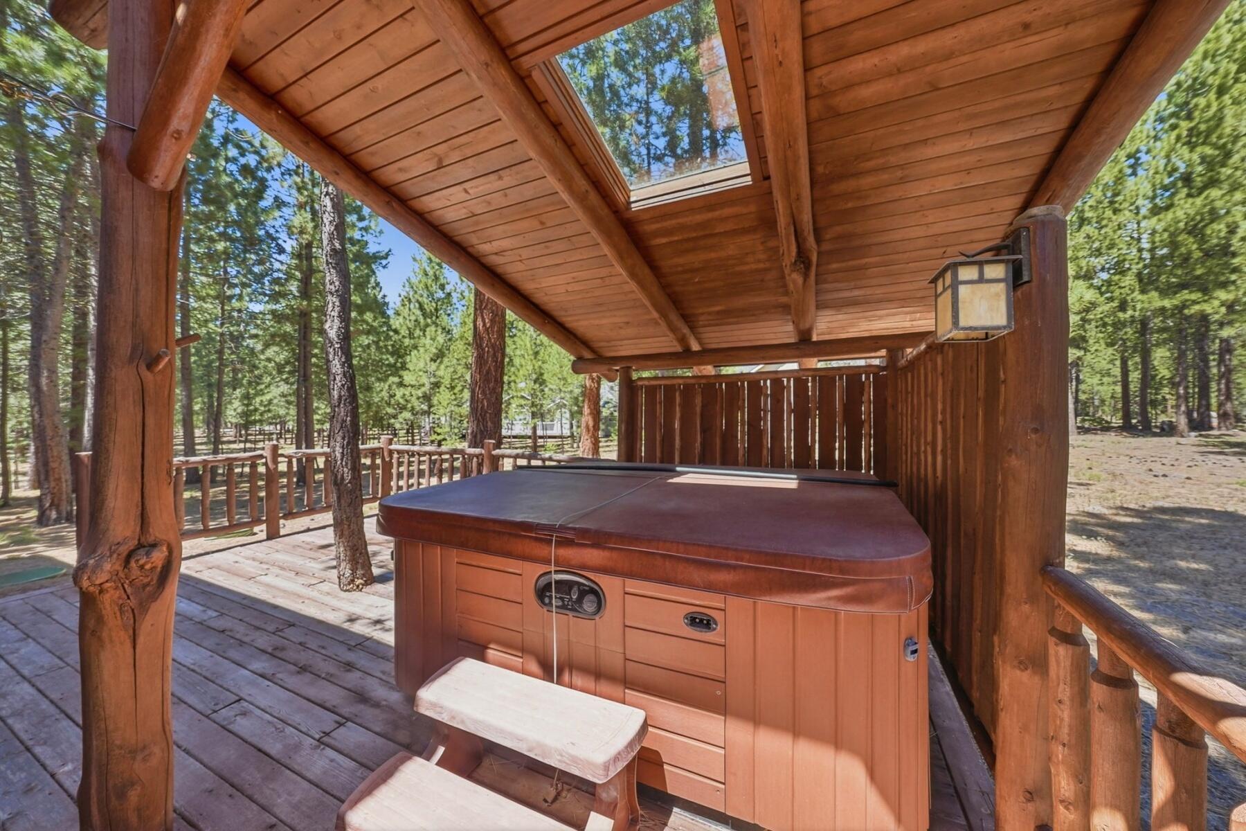 14177 Whitewater Loop La Pine, OR 97739 - Photo 24 of 38 a view of a backyard with table and chairs with wooden floor and fence