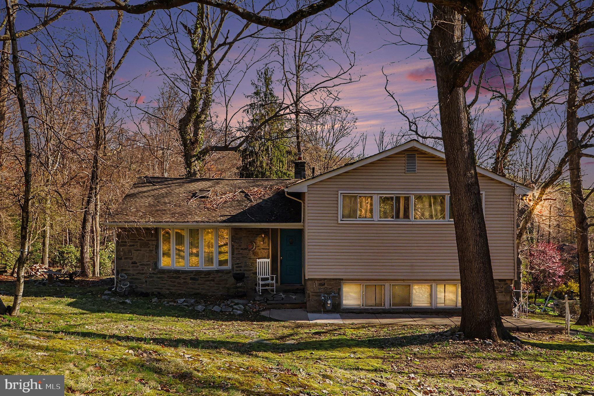 2338 Fairway Road Huntingdon Valley, PA 19006 - Photo 1 of 27 a front view of a house with a yard