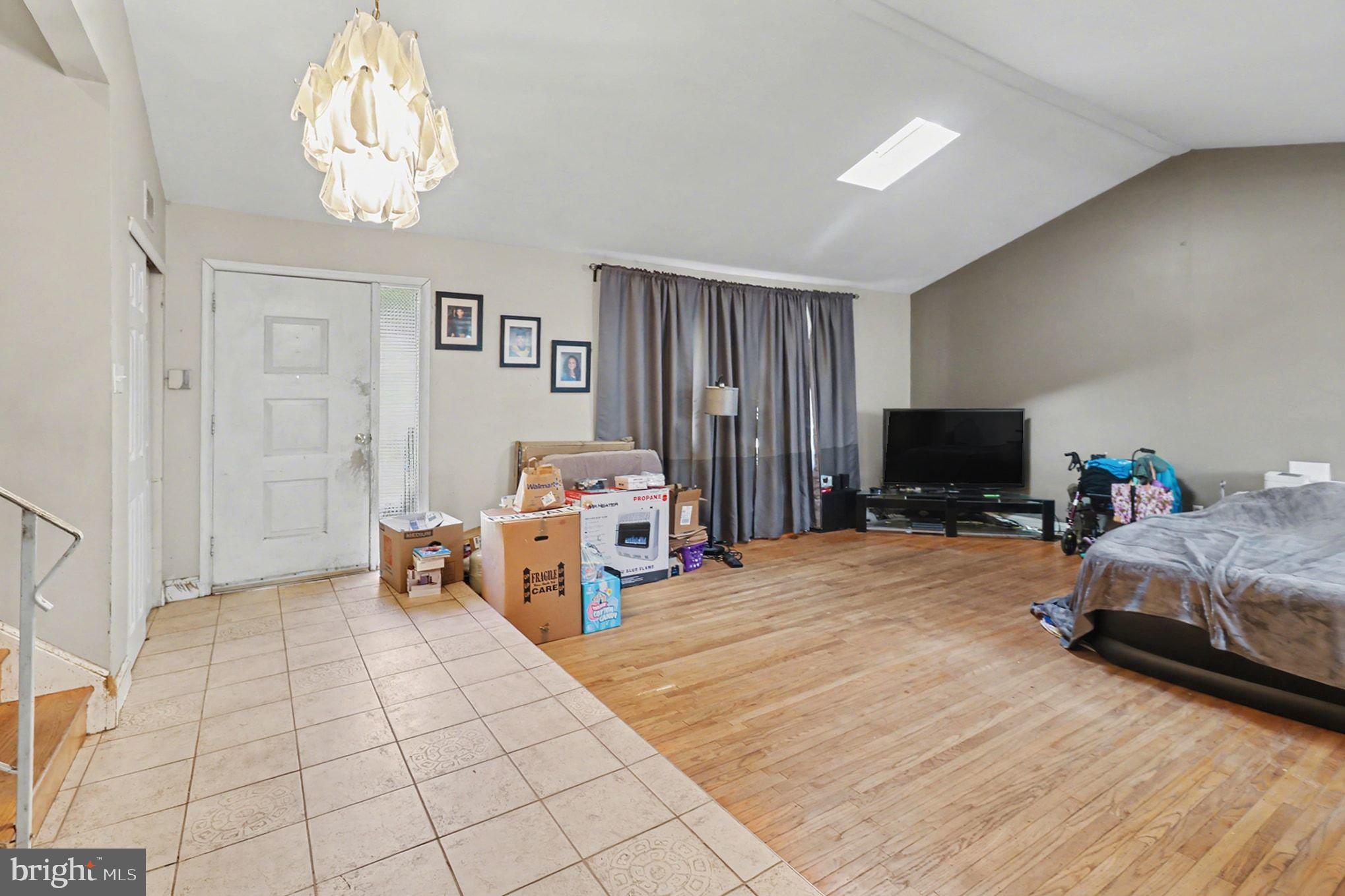 2338 Fairway Road Huntingdon Valley, PA 19006 - Photo 11 of 27 a bedroom with furniture and a chandelier