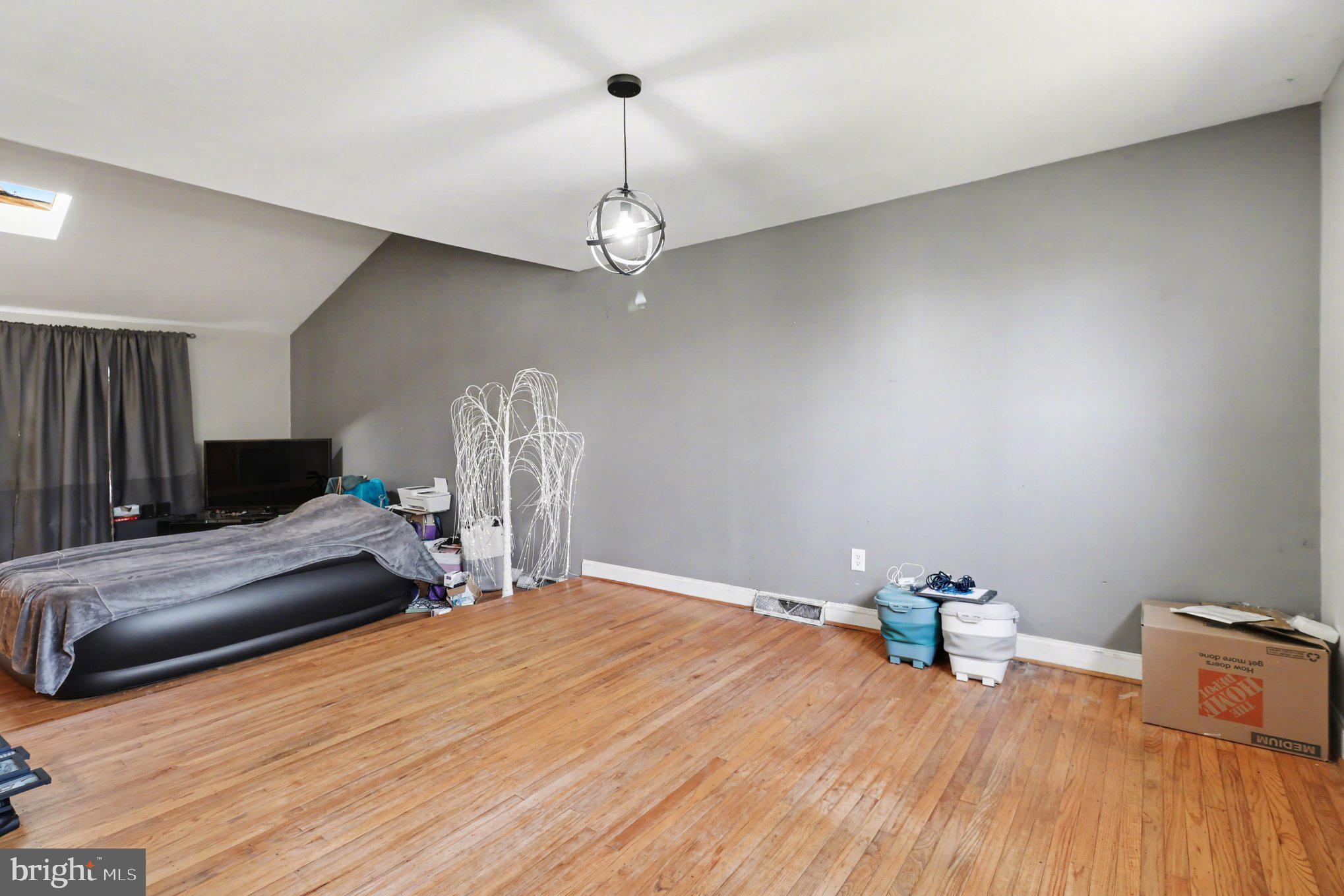 2338 Fairway Road Huntingdon Valley, PA 19006 - Photo 15 of 27 a bedroom with a bed and wooden floor