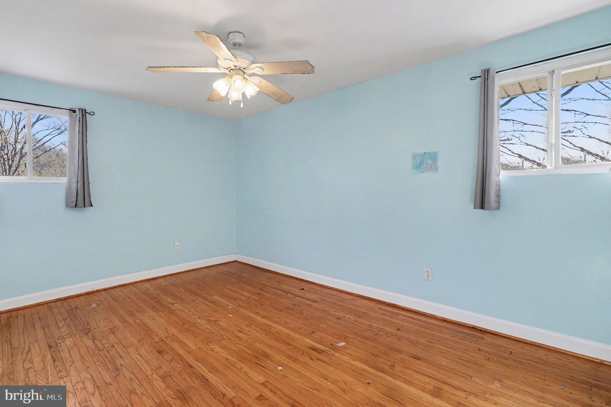 2338 Fairway Road Huntingdon Valley, PA 19006 - Photo 16 of 27 a view of an empty room with wooden floor and a window