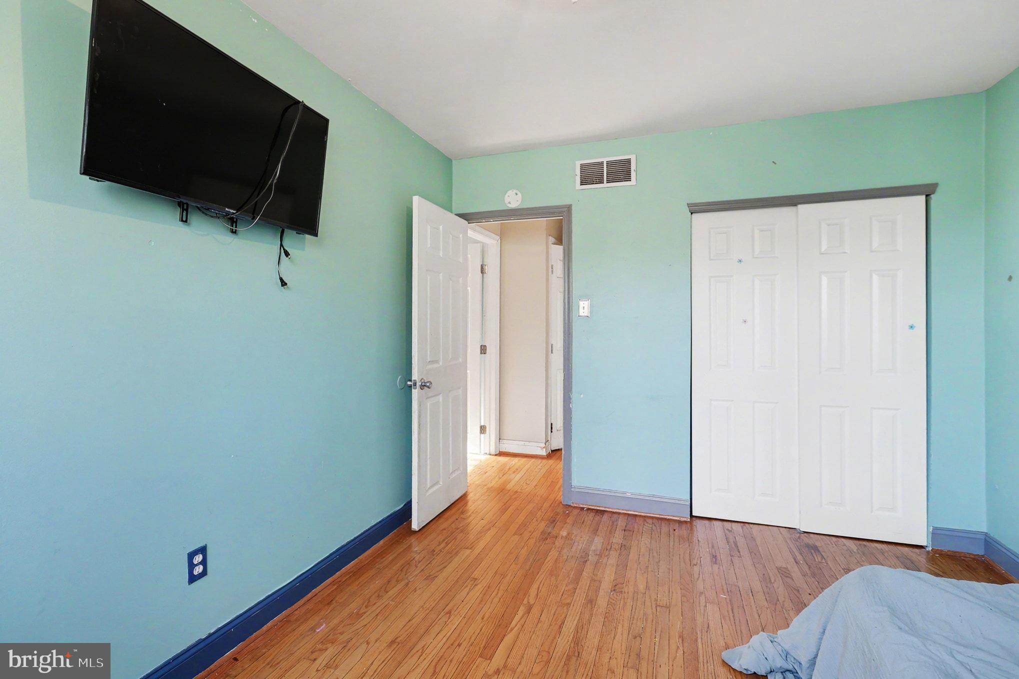 2338 Fairway Road Huntingdon Valley, PA 19006 - Photo 19 of 27 a view of a livingroom with wooden floor and a flat screen tv