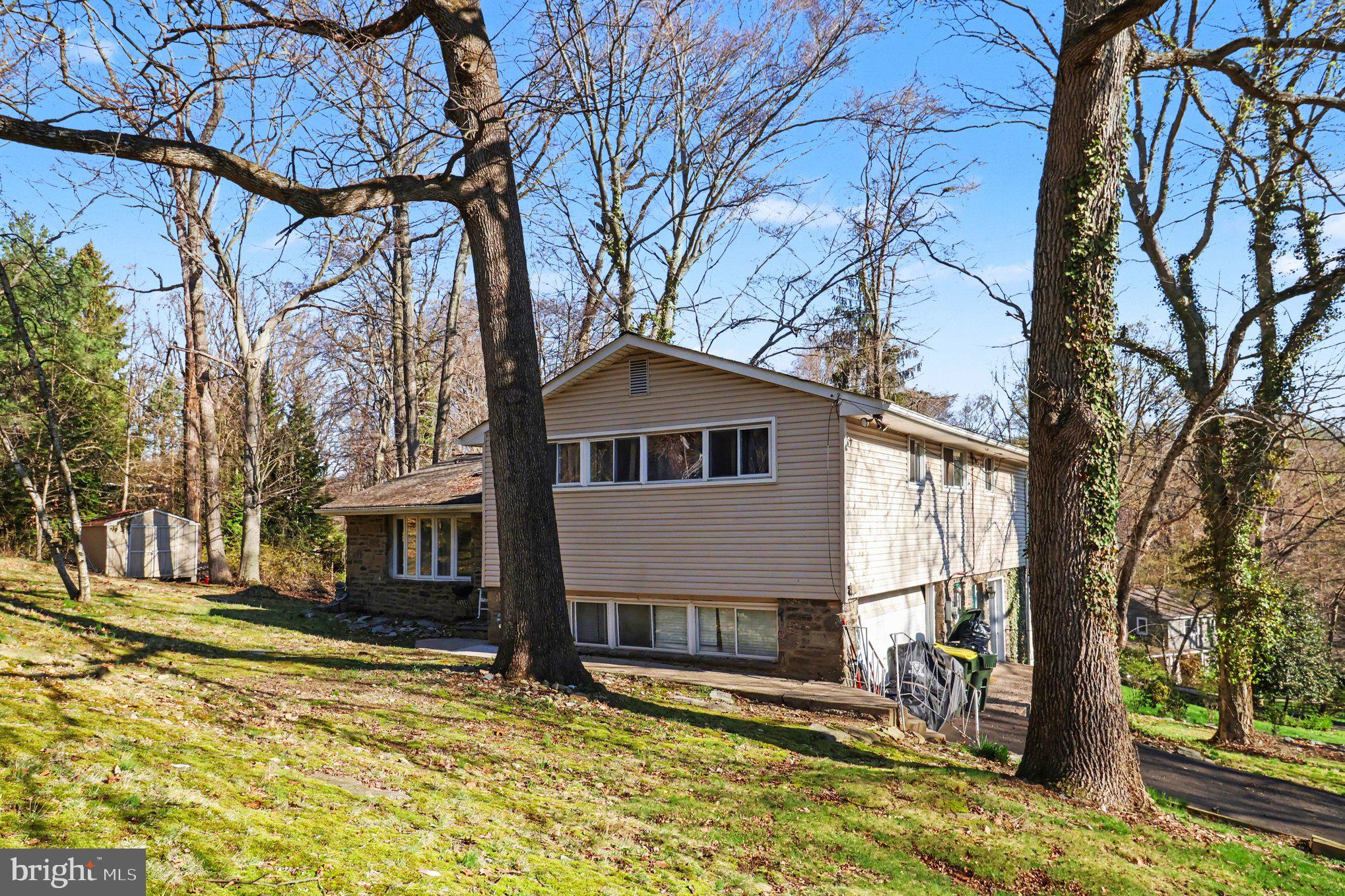 2338 Fairway Road Huntingdon Valley, PA 19006 - Photo 4 of 27 a view of a house with a yard covered with snow and a yard