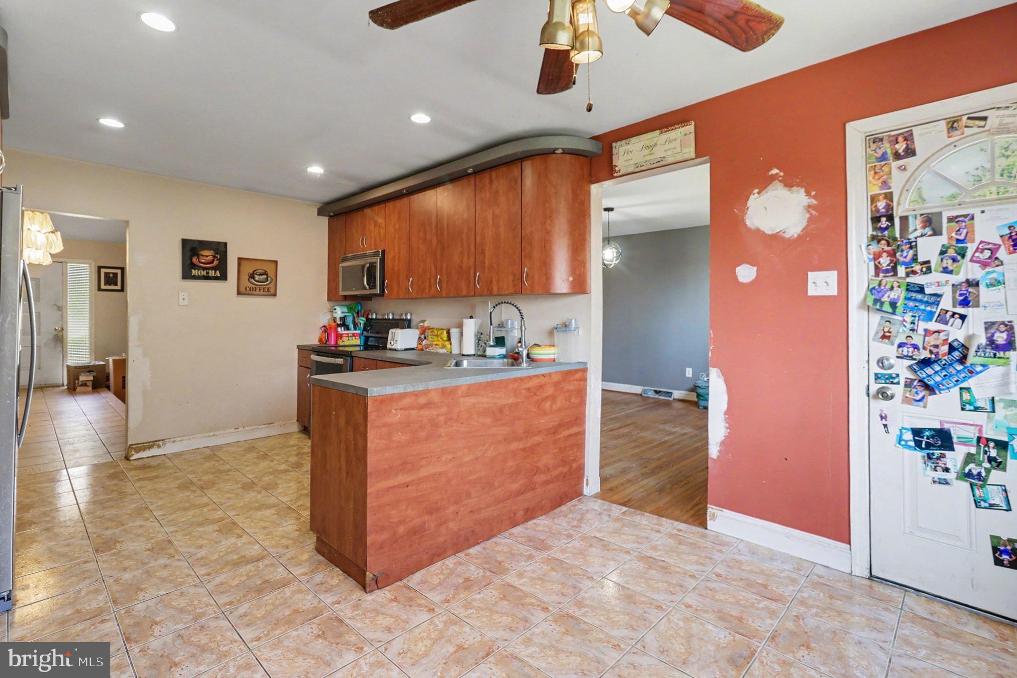 2338 Fairway Road Huntingdon Valley, PA 19006 - Photo 9 of 27 a kitchen with stainless steel appliances granite countertop a refrigerator and a stove