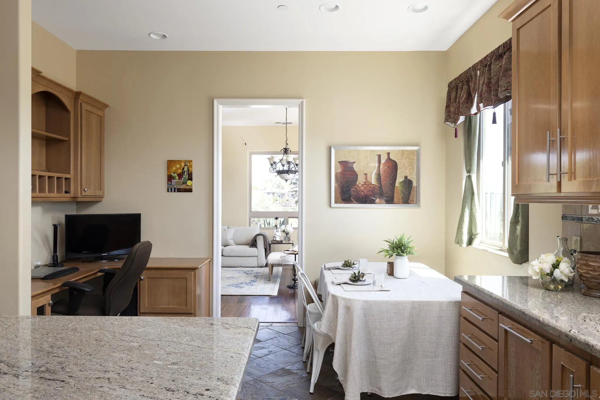 2001 Corte Sierra Alpine, CA 91901 - Photo 16 of 35 a living room with stainless steel appliances kitchen island granite countertop a sink a dining table and chairs with wooden floor