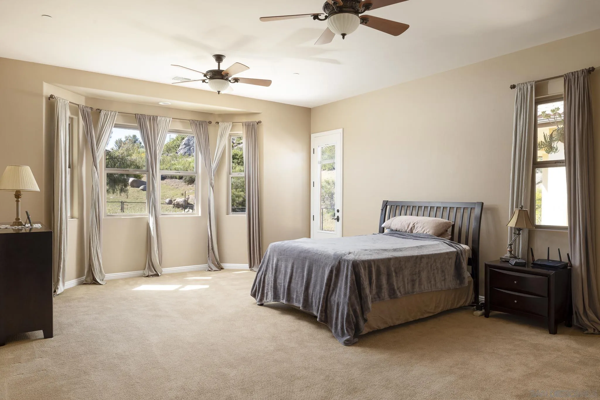 2001 Corte Sierra Alpine, CA 91901 - Photo 18 of 35 a spacious bedroom with a bed dresser and a window
