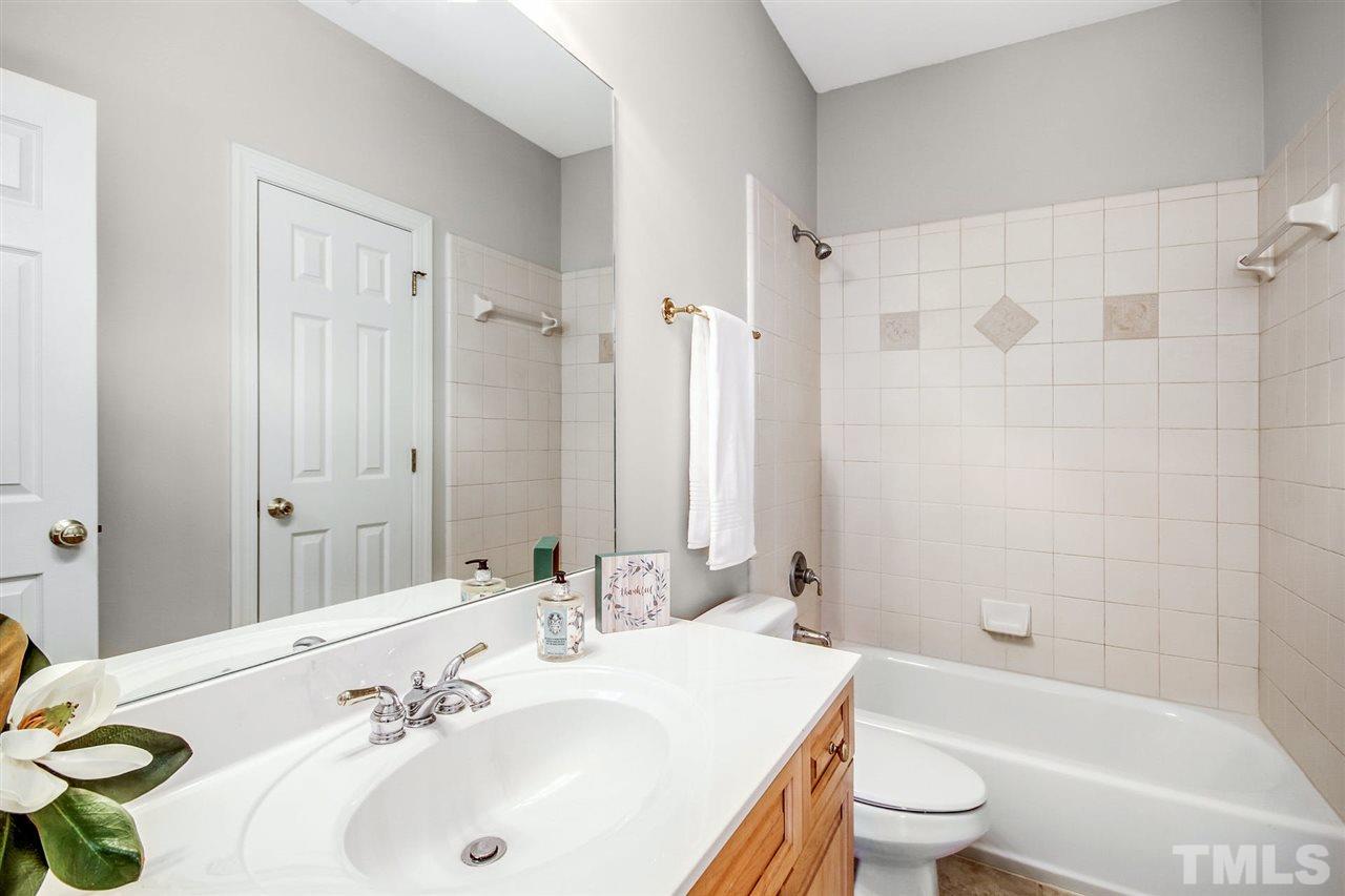 1504 Tradescant Court Raleigh, NC 27613 - Photo 22 of 30 a bathroom with a sink toilet and shower