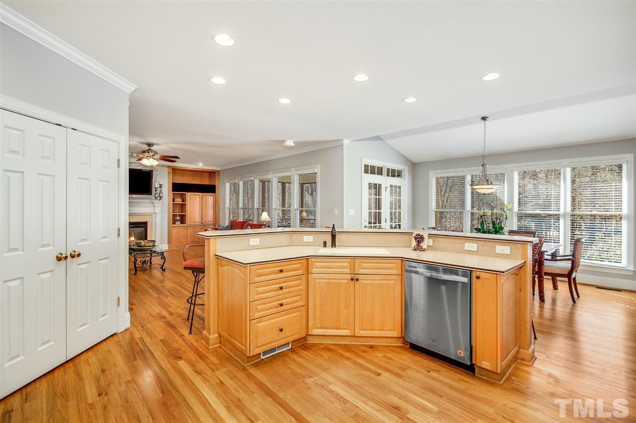 1504 Tradescant Court Raleigh, NC 27613 - Photo 4 of 30 a large kitchen with stainless steel appliances granite countertop a large center island and a sink