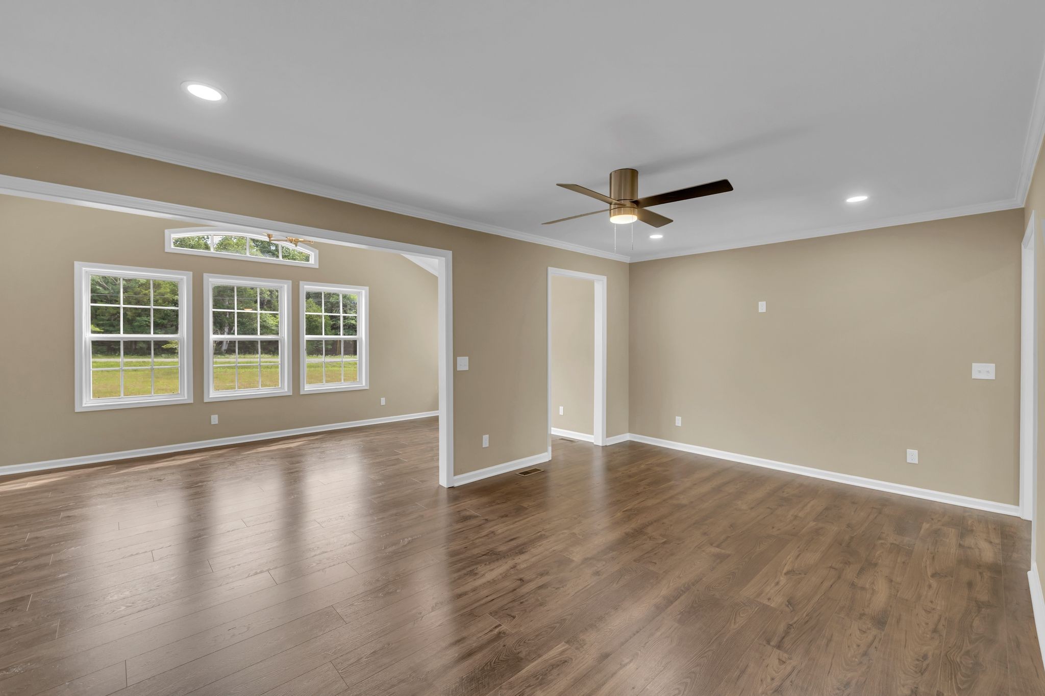5065 Craddock Road Lascassas, TN 37085 - Photo 11 of 51 a view of an empty room with a ceiling fan and wooden floor